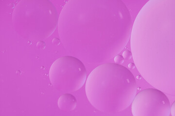 Top view oil bubbles drop on the water with colorful background, Macro photography concept