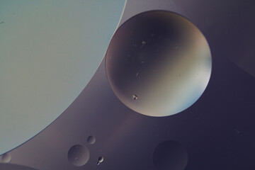 Top view oil bubbles drop on the water with colorful background, Macro photography concept