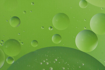 Top view oil bubbles drop on the water with colorful background, Macro photography concept