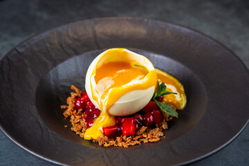 signature frozen tropical dessert on a dark background side view