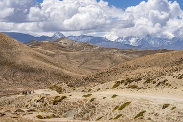 Group of people biking in the Himalayan Mountains in Nepal