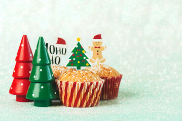 Homemade christmas muffins with fun Christmas signs and christmas trees. Christmas sweet concept