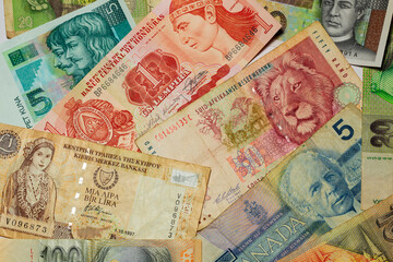 Fototapeta na wymiar Different kinds old Banknotes from the all World in the Detail