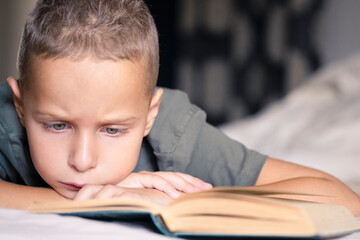 Boy is reading a book. Education concept