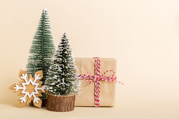 Christmas composition. Gifts, small tree, branches and craft DIY decorations on white background. New year concept. Christmas home decoration Flat lay, top view, copy space