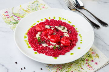 shrimp with beans and herbs in red sauce, side view