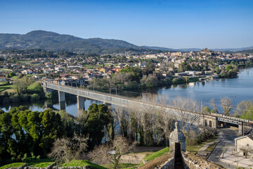 Fototapeta premium View of the International Bridge over the Minho River that connects Tui with Valença do Minho. The view is from the Valença fortress and Tui can be seen in the background.