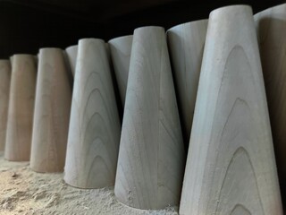 Wooden legs for beds close view, abstract forms background