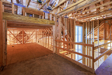During new construction home improvement unfinished framing beams wooden house an building area