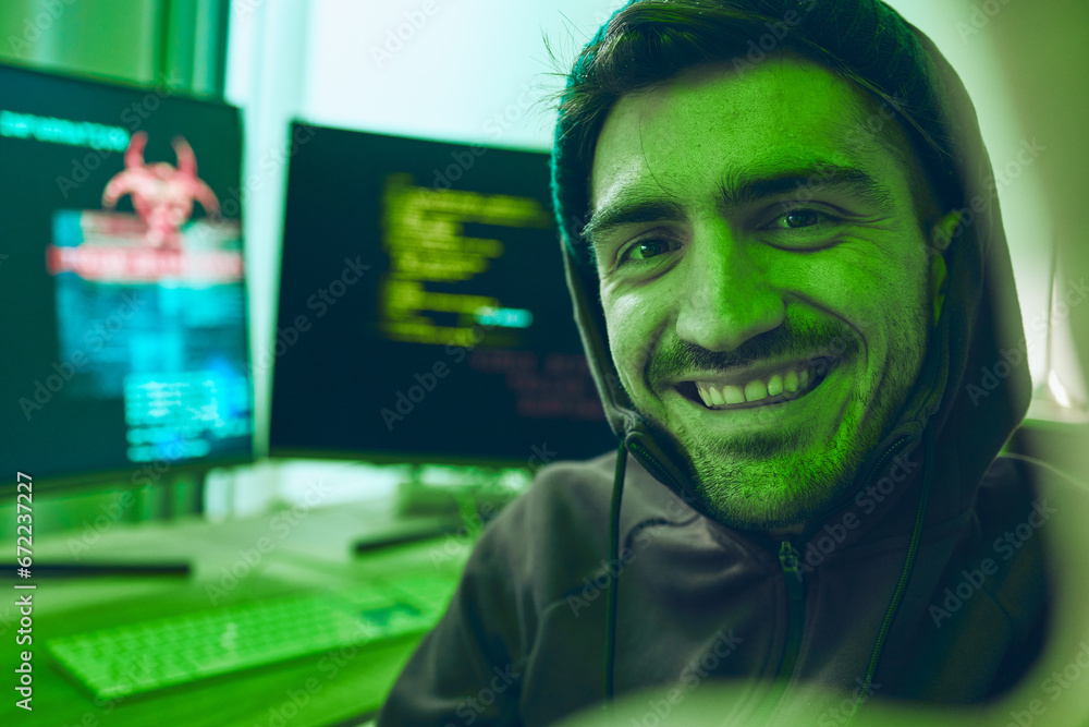 Poster Cybersecurity, crime and smile, portrait of hacker in neon office with code, fraud and virus. Software, ransomware and face of happy man on cyber attack, password thief and online scam with computer.