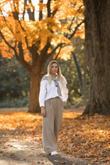  Portrait of sensual woman over autumn fall background.