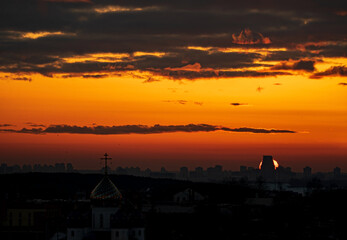 Fototapeta premium sunset over city sky, nature background