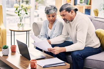 Documents, laptop and senior couple planning, finance paperwork and retirement funding or loan at...