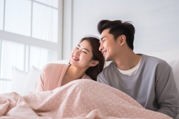 Fototapeta premium Young couple sweet moment together on bed.