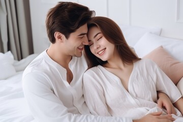 Young couple sweet moment together on bed.