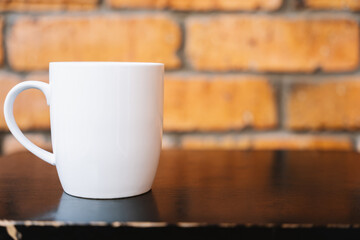 Coffee break with white mug on wooden table