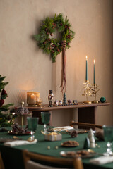 Christmas composition of dining room interior with family table, christmas tree, furniture, decoration, stars, gifts, accessories, deer, candlestick, candle and hanging wreath. Home decor. Template.	

