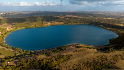Obraz premium Aerial view of Lake Martignano, originally called Lake Alsietino. It is an endorheic lake of volcanic origin located in Lazio, Italy.