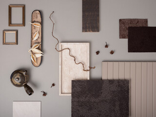 Elegant flat lay composition with textile and paint samples, panels and cement tiles. Stylish interior designer moodboard. Light beige and gray color palette. Copy space. Template.