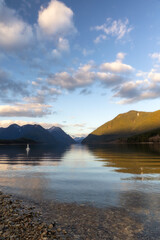South Beach at Alouette Lake in Golden Ears Provincial Park, with shadows on the mountain peaks in the distance. Maple Ridge, British Columbia
