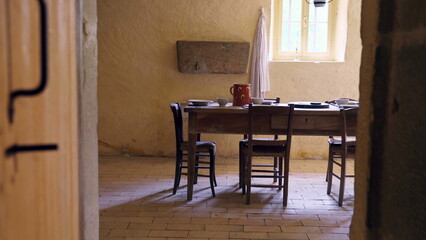 Antique Wooden Dining Setup in Rustic Farmhouse Interior