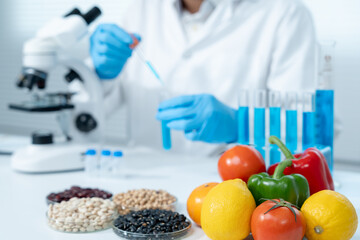 Scientist check chemical food residues in laboratory. Control experts inspect quality of fruits,...
