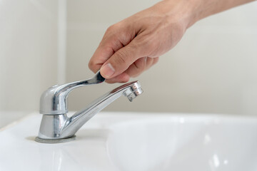 Save water. Volunteer keeps turning off the running water in the bathroom to protect environment....