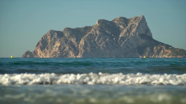 Mediterranean sea, Calpe rock over the horizon in the morning.