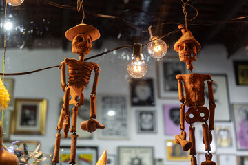 Two skeletons displayed in a shop window on the Day of the Dead