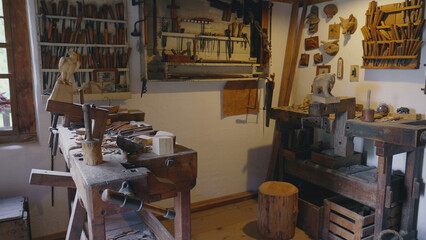 Traditional wooden atelier at rural farmhouse, bricolage handmade equipment and tools, ancient carpentry shop