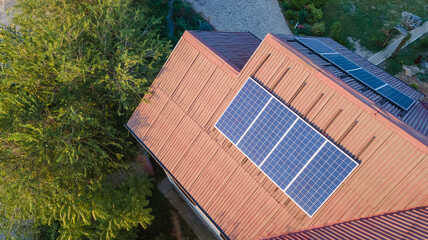 Solar panels on the roof of a house. View from a drone