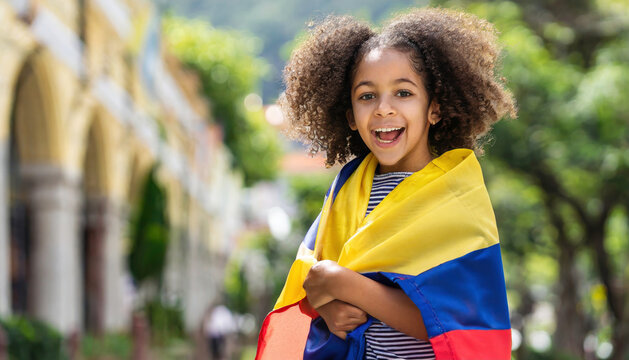 Child wrapped in a Colombian flag