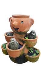  A terracotta planter in the shape of a boy with three small birds in his body. It is a unique and creative garden decoration.