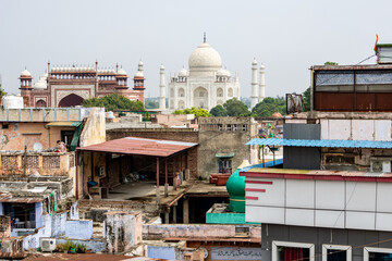 The imposing Taj Mahal in Agra, India, with its wonderful architecture on a cloudy day above the...