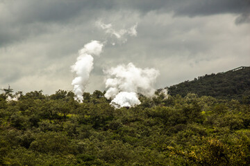 Steam rising above Olkaria Geothermal Power Station in the Hell's Gate National Park, Kenya
