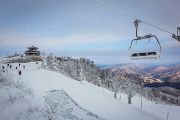 Cable car atop the snow-capped Deogyusan mountains at deogyusan national park near Muju, South...