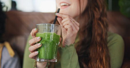 Smoothie, drink and hands of woman in restaurant with healthy, green tea or cocktail of juice with...