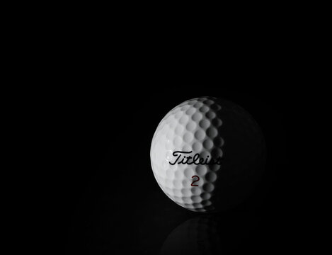 Greenville, SC - USA - 10-25-2023: A Titleist golf ball on black background