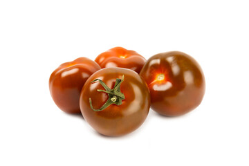 Black tomato isolated on white background. Fresh black tomatoes. Fresh vegetables. Vegan. Close-up. Healthy food. Salad Ingredients.