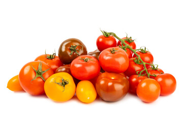 Various colorful tomatoes isolated on white background. Fresh yellow, red, black, pink and brown tomatoes. Fresh vegetables. Vegan. Close-up. Healthy food. Salad Ingredients.