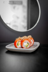 Classic Philadelphia sushi roll set with salmon and cream cheese.