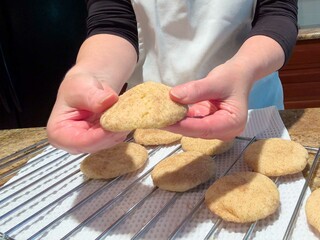 Close up of fresh baked snickerdoodles on rack