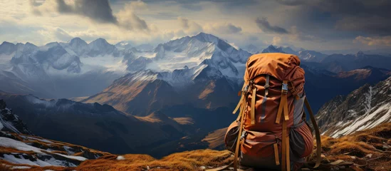Fotobehang Climbing equipment set against a stunning mountain vista. © maniacvector