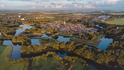 Aerial view of the historic town of Naarden and its star-shaped canals during sunrise. Dutch history - obrazy, fototapety, plakaty
