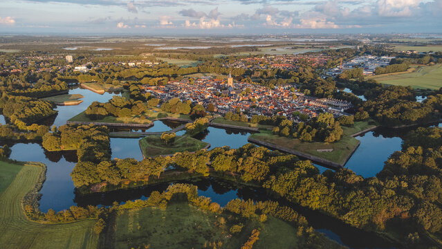 Aerial View Of The Historic Town Of Naarden And Its Star-shaped Canals During Sunrise. Dutch History