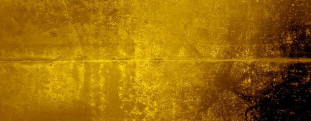 grunge yellow rusty on metal wall background texture used as banner panorama. old gold metal grunge...