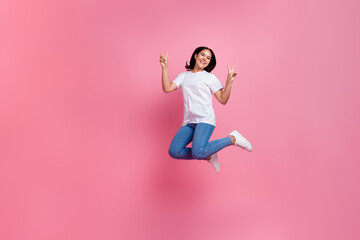 Fototapeta na wymiar Full length photo of funky active woman jumping trampoline showing double v sign at black friday promo ad isolated on pink color background