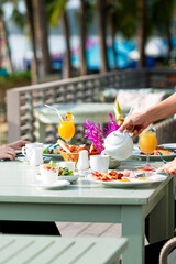 Breakfast on outdoor table,Morning and breakfast on the sea beach,Holiday - Event,Lunch,Party - Social Event,Picnic Table,Senior Adult,