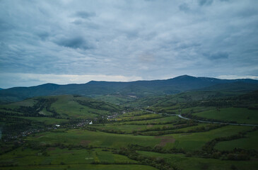 Fototapeta na wymiar Aerial drone photo of a green valley in Carpathian mountains in Western Ukraine