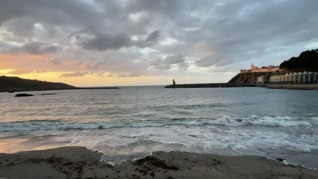Sunset on Luarca beach, town in Asturias (Spain)